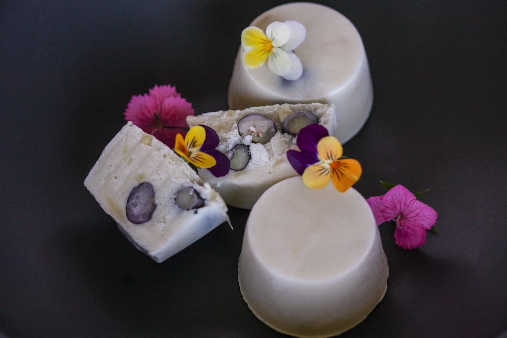 Gaia Tree's blueberry delights cross-sectioned and adorned with flowers