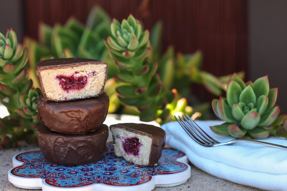 Gaia Tree's vegan chocolate coated coconut cups with a raspberry jam centre