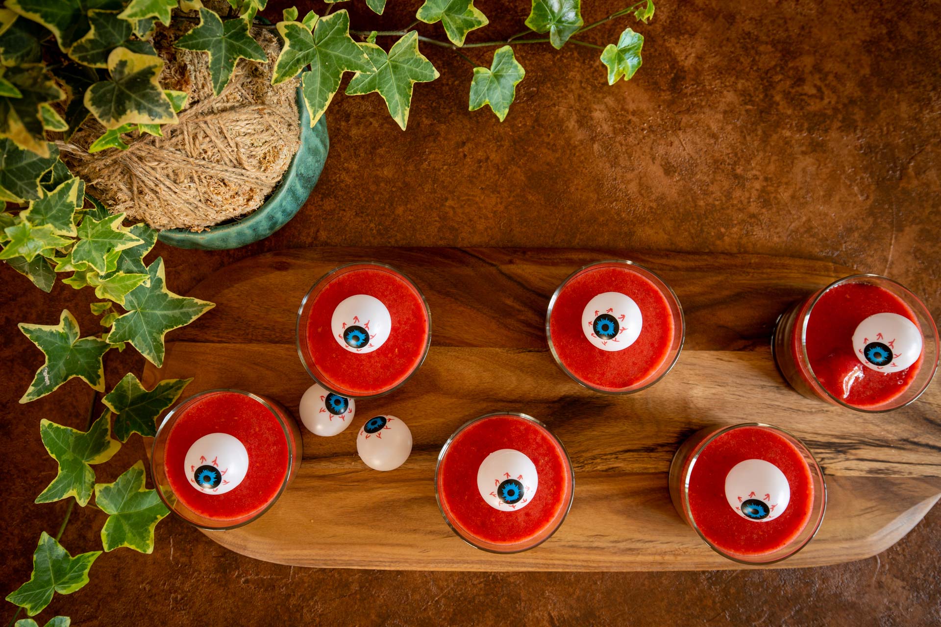 Top view of Gaia Tree's chilled vegan chocolate pudding showing off the lushious layers of chocolate and stawberry sauce