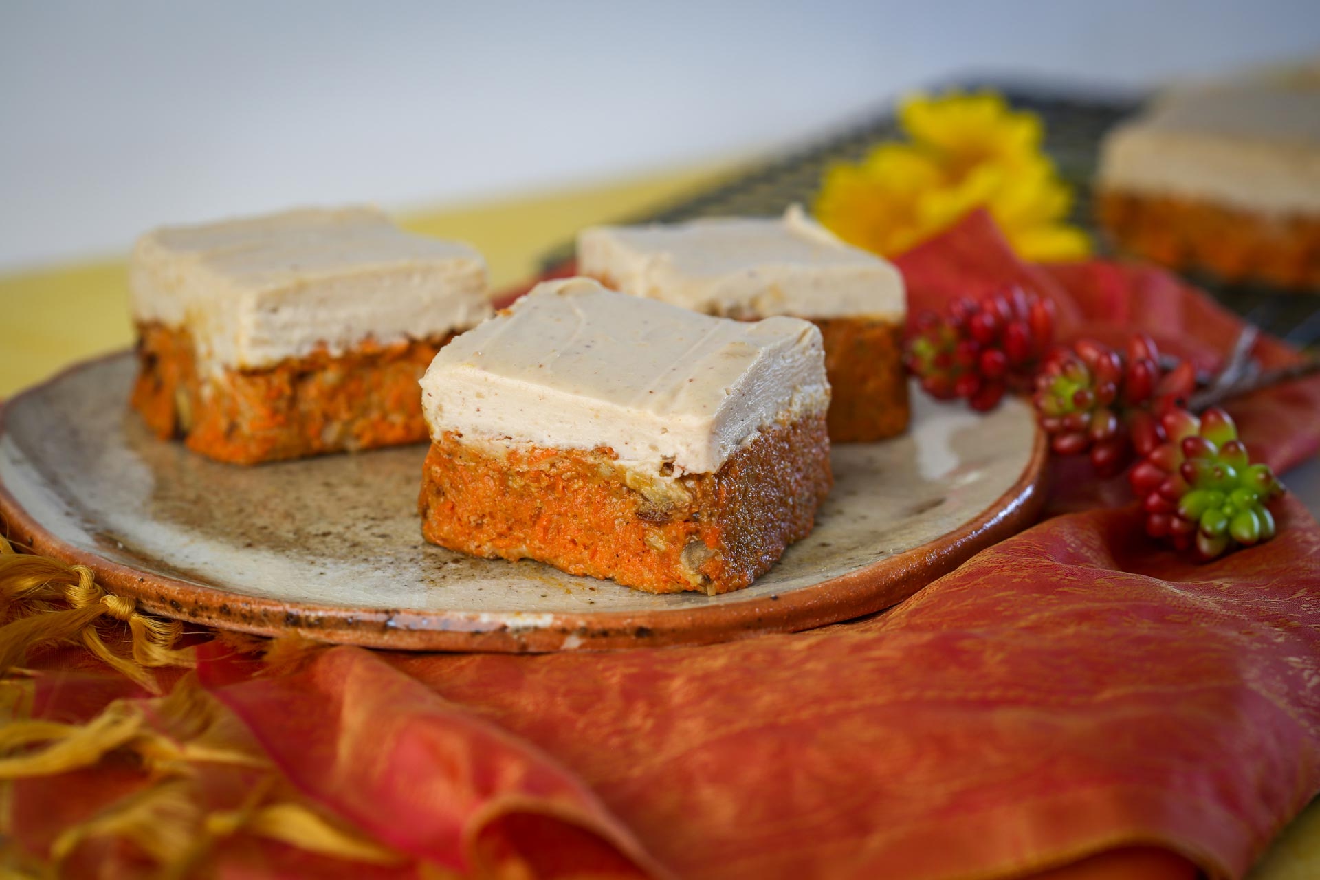 Three slices of carrot cake halva slice on a ceramic plate