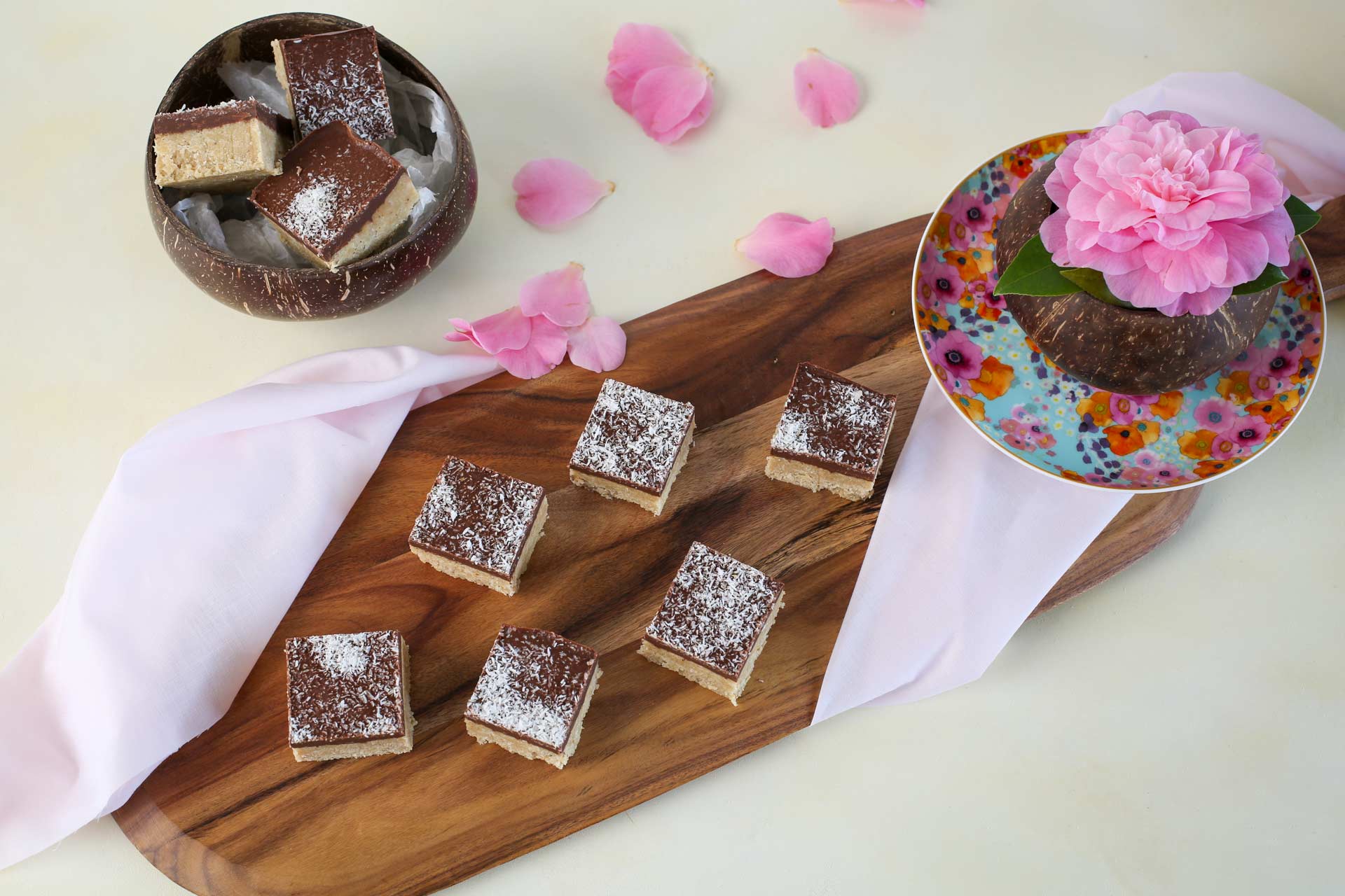 A raw slice version of a bounty bar made of coconut and chocolate on a platter
